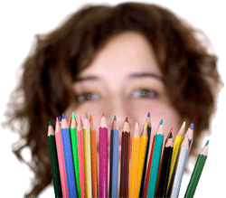 A girl with a bunch of colored pencils in front of her face. (Keywords: colored pencils, girl)