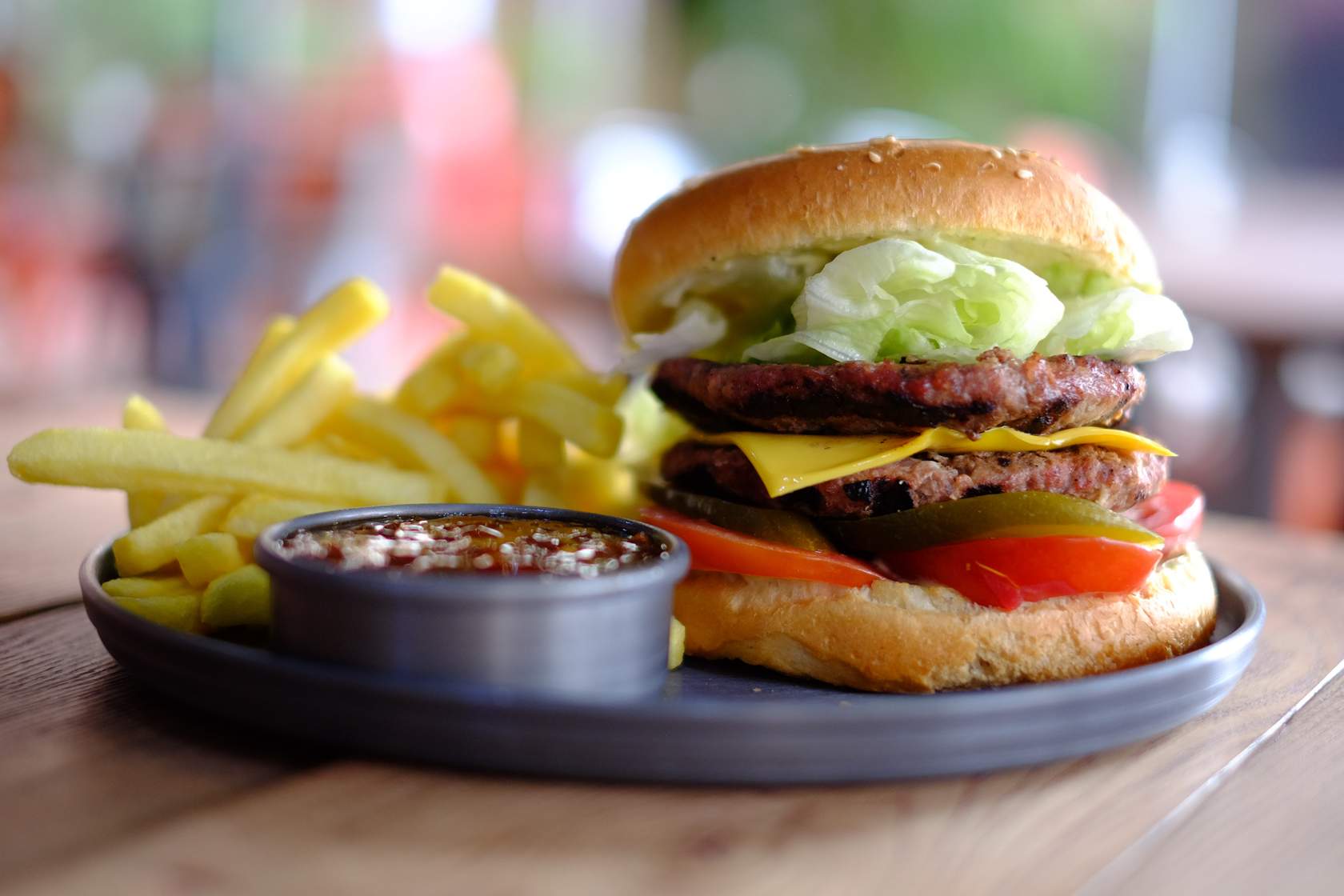 A burger with fries on a plate, demonstrating sample psychological functions of stimuli.