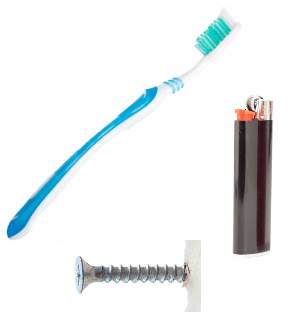 A toothbrush and lighter on a white background.