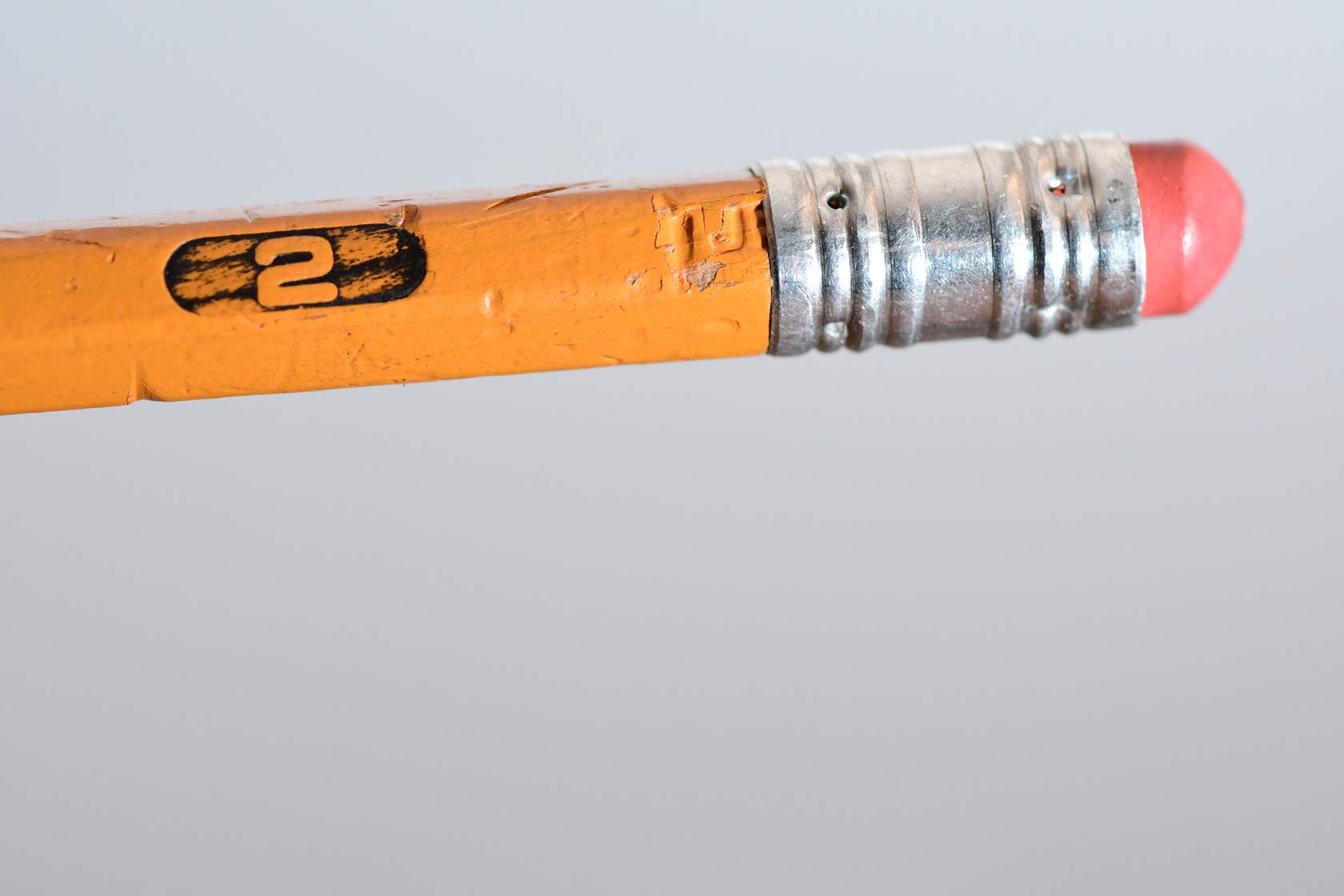 A close up of a yellow pencil.