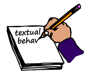 A hand writing the word textual behavior on a piece of paper as an example.