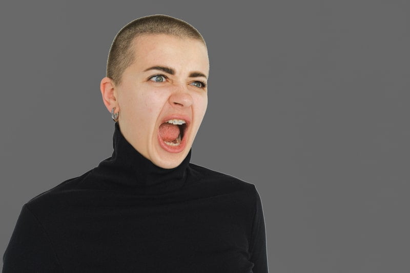 A woman is screaming with her mouth open on a gray background, serving as an intervention example.