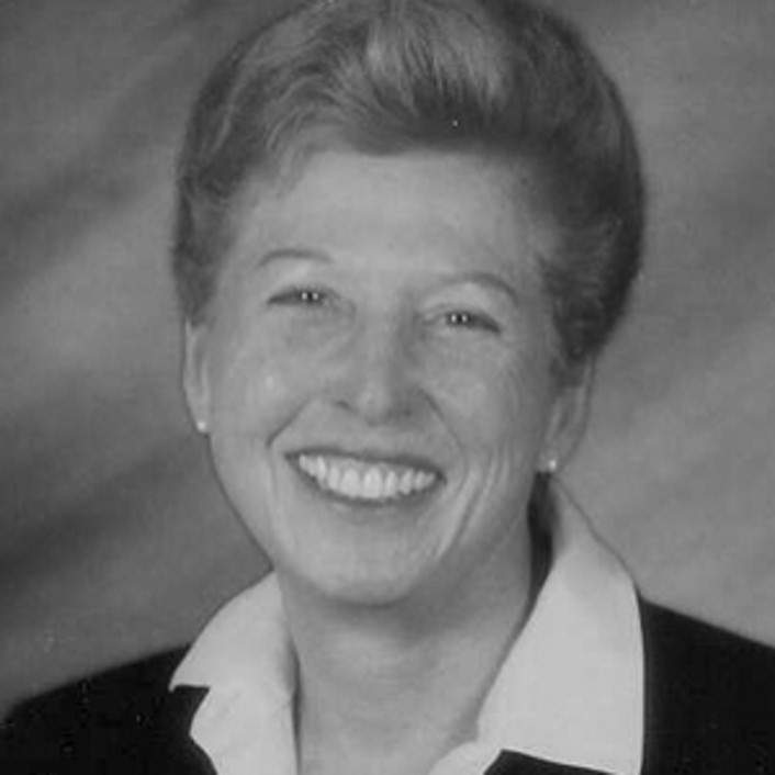 A high-value black and white photo of a smiling woman.